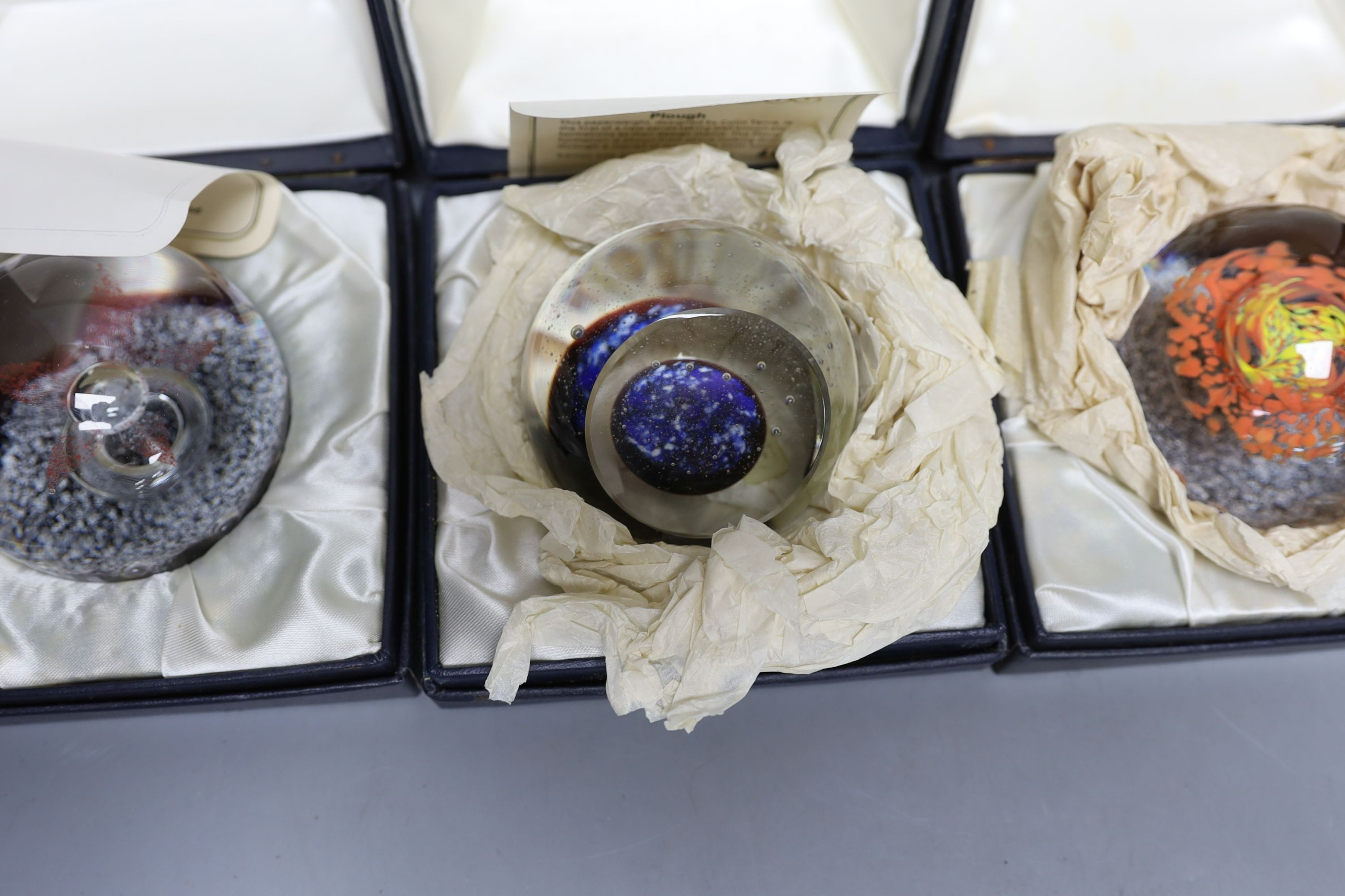 Four cased Caithness glass paperweights